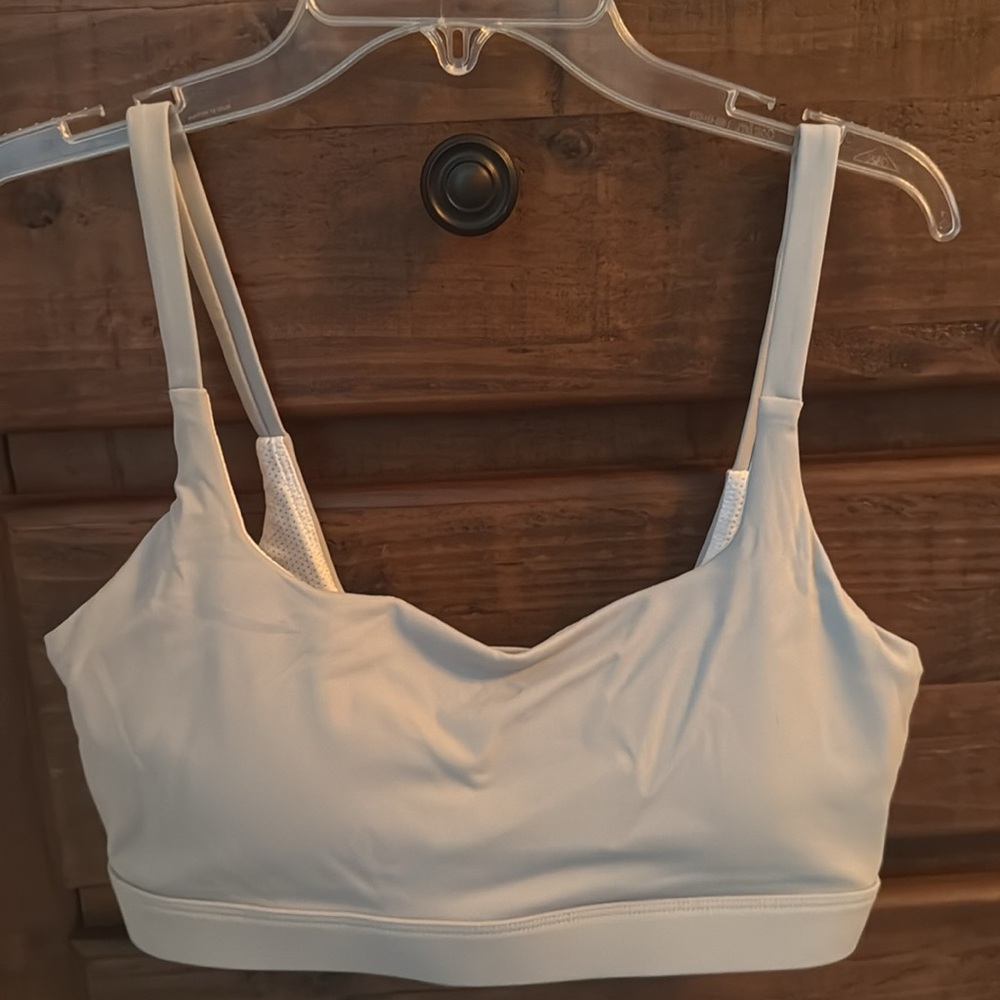 Sports bra. Never worn. Size: medium.Color: Bluish grey. - Picture 2 of 4